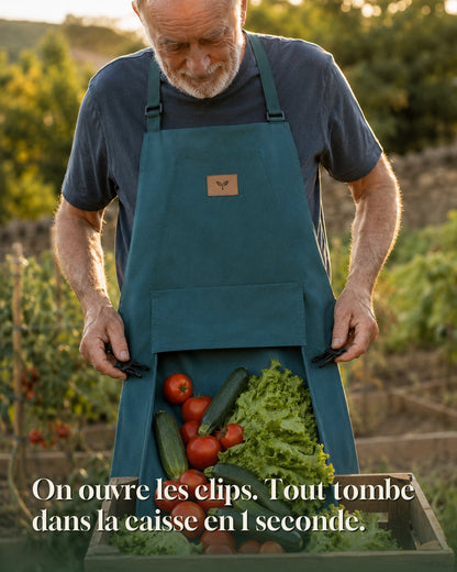 Vidange du tablier Cueillo : le fond s'ouvre par deux clips et la récolte glisse dans la caisse en une seconde